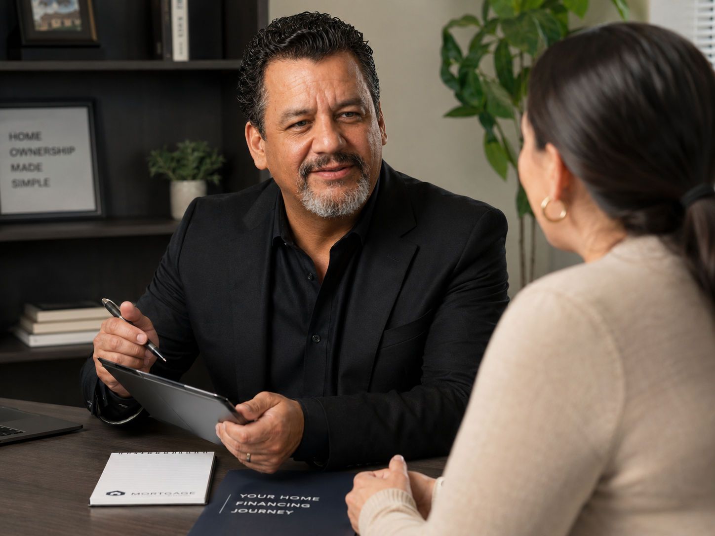 Angel Rodriguez reviewing home loan options with a Texas homebuyer